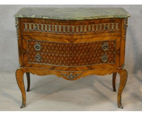 A Louis XV style kingwood and inlaid serpentine fronted marble topped commode with ormolu mounts raised on shaped cabriole su