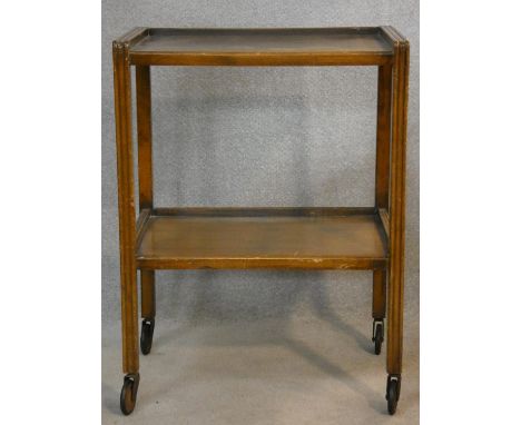 A vintage oak two tier trolley on casters. H.79 L.60 W.41cm