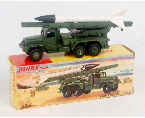 Dinky Toys, 665 Honest John Missile Launcher, green body and hub, white white missile, in the original picture sided all card