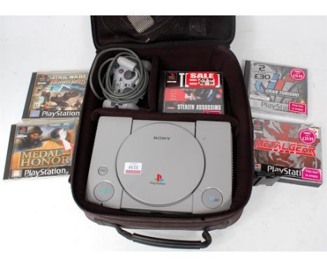 Playstation 1 Group, to include PS1 Console, 5 various games, 1 controller, and power leads, all in a Playstation carry case
