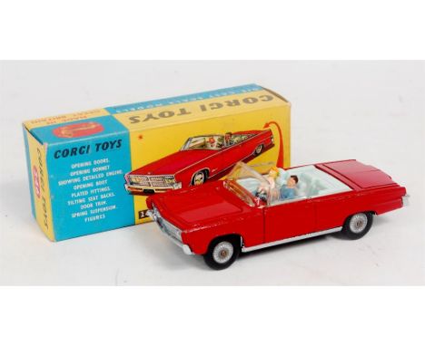 Corgi Toys, 246 Chrysler Imperial convertible, deep red body with light blue interior, with driver figure and golf trolley in