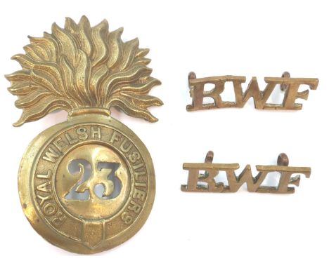 Royal Welsh Fusiliers 23rd Regiment of Foot Victorian cap badge and a pair of shoulder flashes (3). P&amp;P Group 1 (£14+VAT 