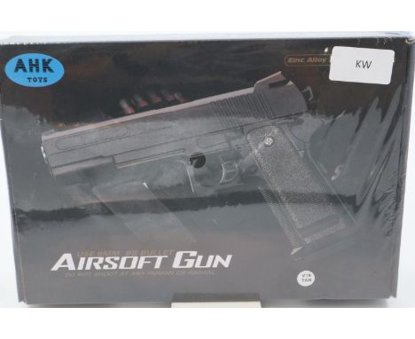 New boxed 6mm BB airsoft pistol, model V19, in tan. P&amp;P Group 2 (£18+VAT for the first lot and £3+VAT for subsequent lots