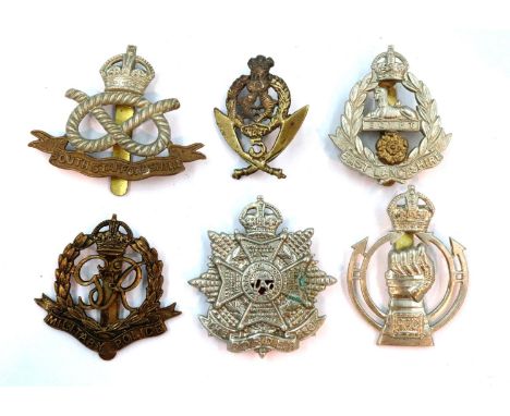 Six British WWII cap badges, including East Lancashire Regiment, Border Regiment etc. P&amp;P Group 1 (£14+VAT for the first 