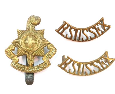 Royal Sussex Regiment 2nd Artillery Volunteers WWI cap badge, a further Royal Sussex cap badge and a pair of shoulder flashes