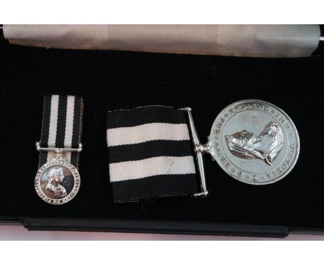 A boxed service medal of the Order of St John, with medal miniature. P&amp;P Group 1 (£14+VAT for the first lot and £1+VAT fo