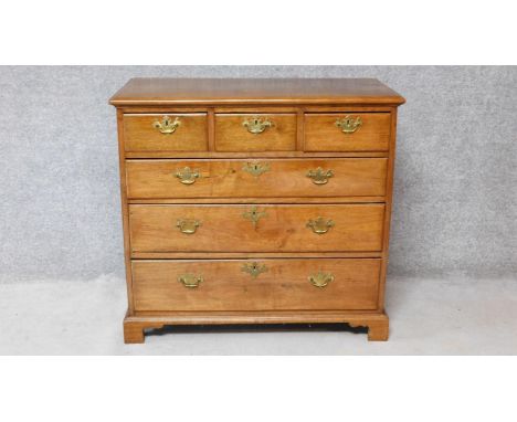 A Georgian mahogany chest of three short over three long graduated drawers on bracket feet. H.92xW.100xD.50cm 
