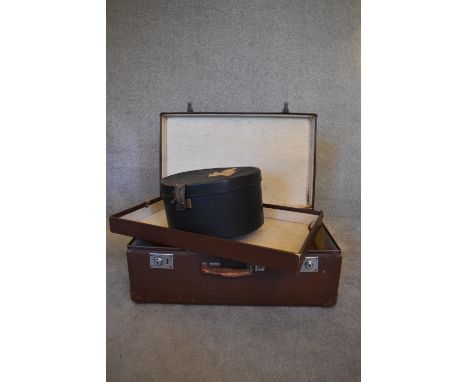 A vintage suitcase with lift out tray, a hat box and a small vintage attache case. H.26 x 68cm 