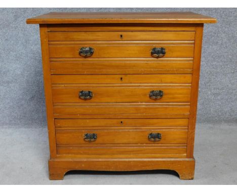 A Victorian satin walnut chest of three drawers on bracket feet. H.83 W.84 D.52cm 