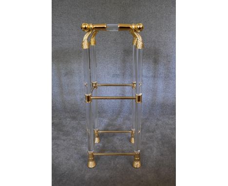 An Empire style gilt framed lamp table with clear perspex and glass fittings, shelves and tops and mirrored base. 40 x 90cm 