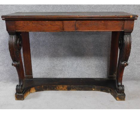 An early 19th century oak console table with two frieze drawers on carved cabriole front supports. H.91 W.123 D.46cm 