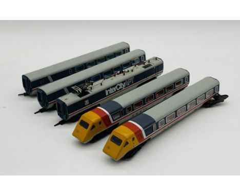 Two unboxed Hornby OO gauge Class 370 Driving Coaches (SC48101 & SC48102), along with two matching passenger carriages and In