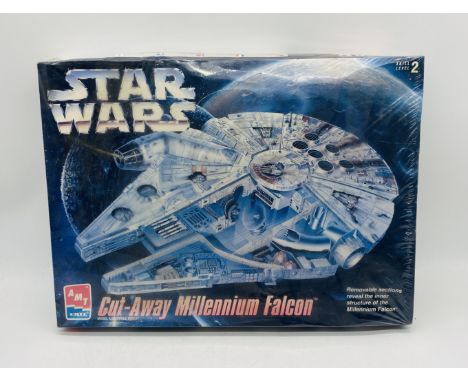 A sealed ERTL Star Wars Cut-Way Millennium Falcon plastic model kit