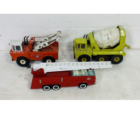 Three large Tonka toy vehicles including a Ready Cement Mixer, Fire Engine and Breakdown Truck