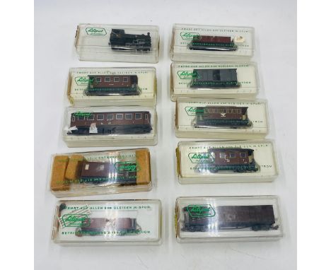 A collection of ten cased Liliput N gauge model railways locomotive, passenger cars, freight car, bogie good van, wagons etc
