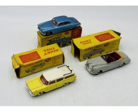 Three boxed vintage Dinky Toys die-cast cars including Jaguar Mark X (142), Rambler Cross Country Station Wagon (193) & Bentl