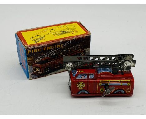 A vintage boxed Yone Tinplate Mechanical Fire Engine with self-extending ladder,  