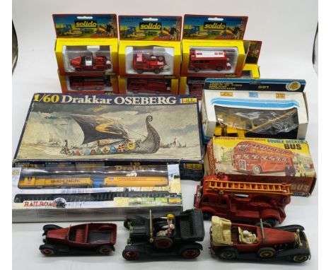 A collection of various toys including six boxed Solido fire department vehicles, Polythene Friction Drive double-decker bus,