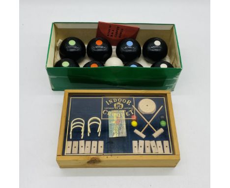 An indoor carpet bowls set, along with an indoor Dry Gin miniature croquet set