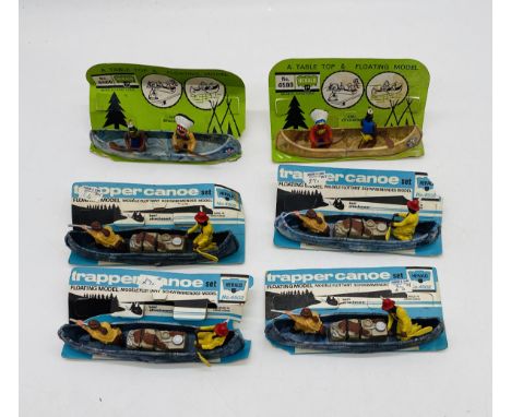 A collection of four carded Trapper Canoe sets (No 4502), along with two carded Herald Floating Models canoe sets (No 4500)