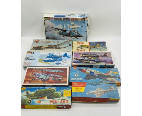 A collection of nine various vintage plastic model kits in the form of military planes including two Airfix's models (Douglas