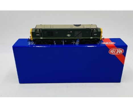 A boxed Heljan OO gauge British Railway Class 23 "Baby Deltic" locomotive in green livery with full yellow ends and double ar
