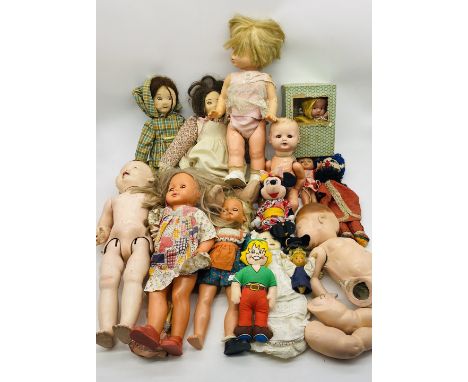 A collection of vintage dolls and soft toys