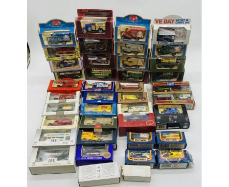 A collection of boxed die-cast vehicles including Matchbox Models of Yesteryear, Lledo Forces Sweethearts, Gilbow Exclusive F