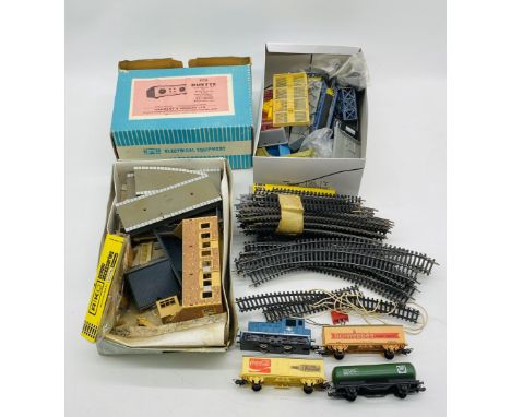 A collection of OO gauge model railway accessories including buildings, platform, Lima Shunter locomotive, three wagons, plat