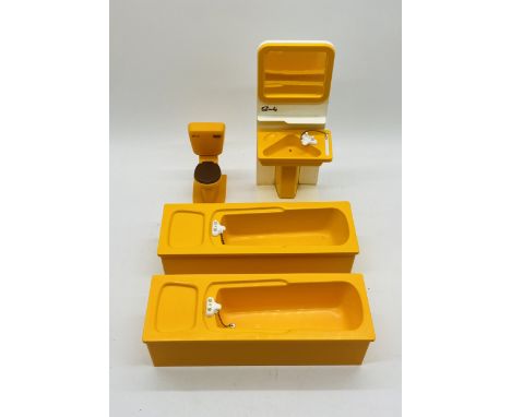 A vintage Sindy bathroom set comprising of a sink with mirror, toilet and two baths