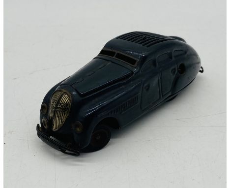 A vintage Schuco Kommando Anno 2000 clockwork tinplate model car in black - no key