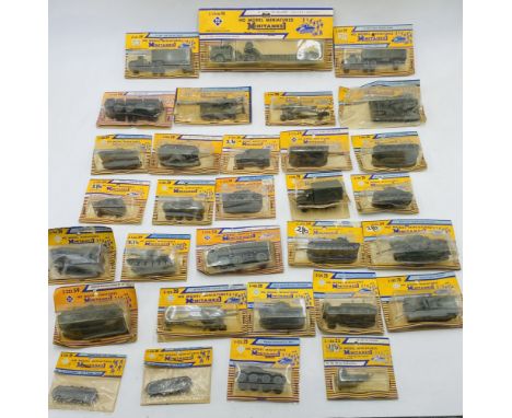 A collection of vintage carded Roco HO Model Miniatures Minitanks military vehicles - some sealed, some opened
