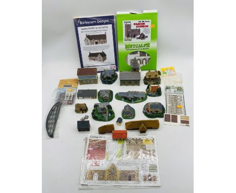 A collection of buildings for model railway, including two OO gauge pre-cut kits, N gauge fencing etc