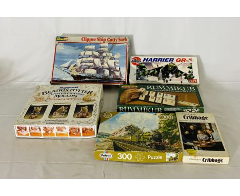 Two plastic model kits including an Airfix Harrier GR-6 Jet and Revell Cutty Sark, along with a boxed Waddingtons Cribbage, S