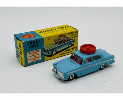 A boxed Corgi Toys die-cast Austin A60 De Luxe Saloon Motor School Car in light blue (236)