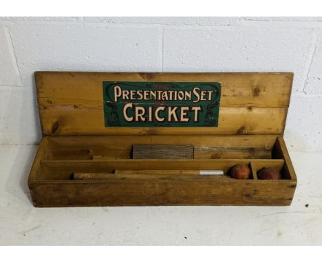 A vintage boxed "The Presentation Set of Cricket" comprising of two sets of wickets and cricket ball - lid broken on box