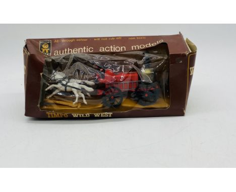 A vintage boxed Timpo Toys Fire Engine from the Wild West Wagon Series, comprising of two horse team, red Clay County Fire Se