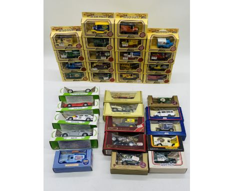 A collection of various boxed die-cast vehicles including Lledo Days Gone, Matchbox Models of Yesteryear, Lledo Tetley, View 
