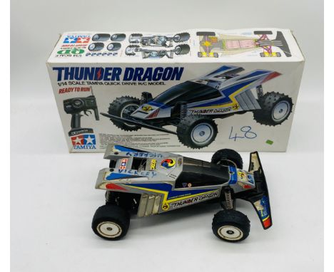 A boxed Tamiya Thunder Dragon quick drive remote controlled model (1:14 Scale)