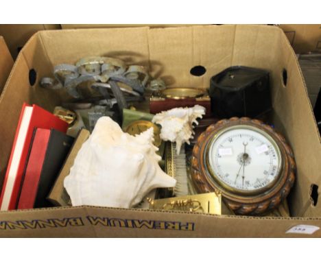 Box of assorted miscellaneous to include wheel barometer, shell ornaments, modern Bentima alarm type clock, horse shoe, ornam