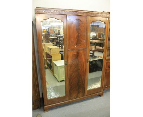 Early 20th Century mahogany two mirror door wardrobe with fitted shelf and drawer interior.