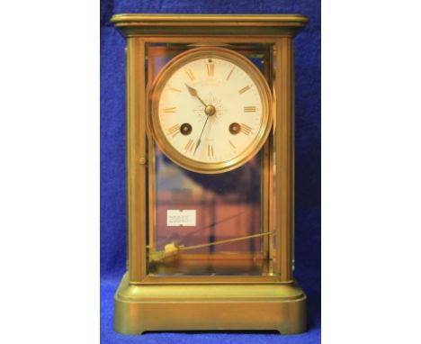 French brass four glass mantle clock, the face marked Howell James & Co. "To The Queen", two train movement striking on one b