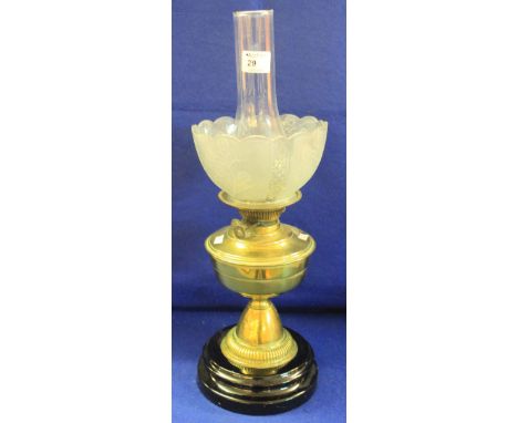 Early 20th Century brass double burner oil lamp with brass reservoir and pedestal on ceramic base, together with molded glass