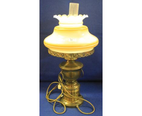 Plated metal table lamp in the form of an oil lamp with opaque shade and chimney.  