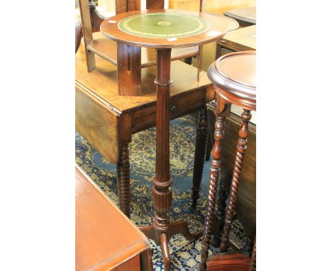 Reproduction mahogany leather top tripod jardiniere stand.