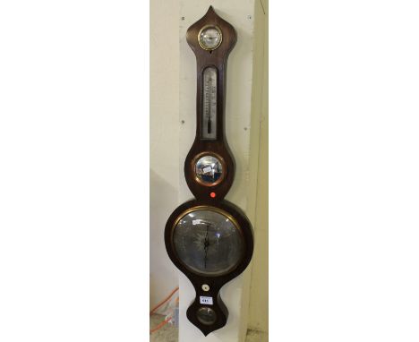 Late 19th/early 20th Century mahogany wheel barometer with silvered dials.