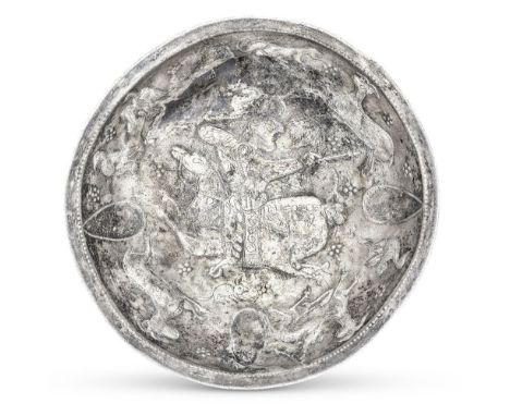  A Sasanian silver dish with a Royal hunting scene Circa 5th-7th Century A.D. 18cm diam. Footnotes:Provenance:Joseph Brummer 