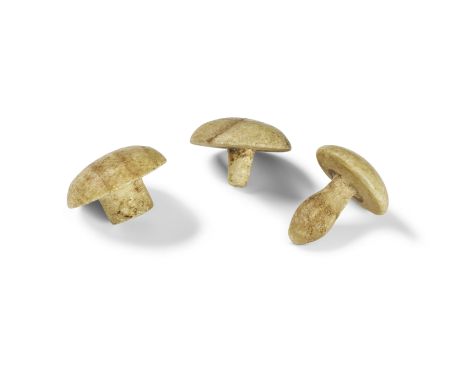  An Egyptian alabaster two-part earplug and another Egyptian alabaster earplug New Kingdom, 18th Dynasty, circa 1478-1425 B.C