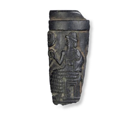  An Old Babylonian steatite cup fragment with a seated King Circa 1800 B.C.5cm highFootnotes:Provenance:Colonel Norman Colvil
