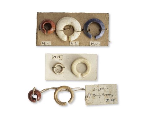  Seven Egyptian hair rings New Kingdom, circa 1550-1069 B.C.Including jasper, alabaster, shell or bone and mid-blue glazed ex
